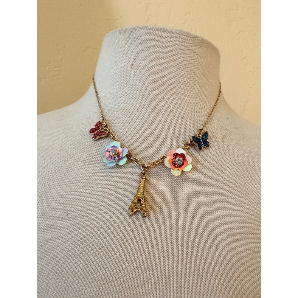 Claires Gold Tone Paris Eiffel Tower Charm Necklace Flowers Butterflies